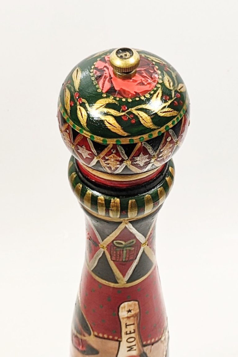 A detailed view of the top of my Christmas-themed hand-painted pepper mill.